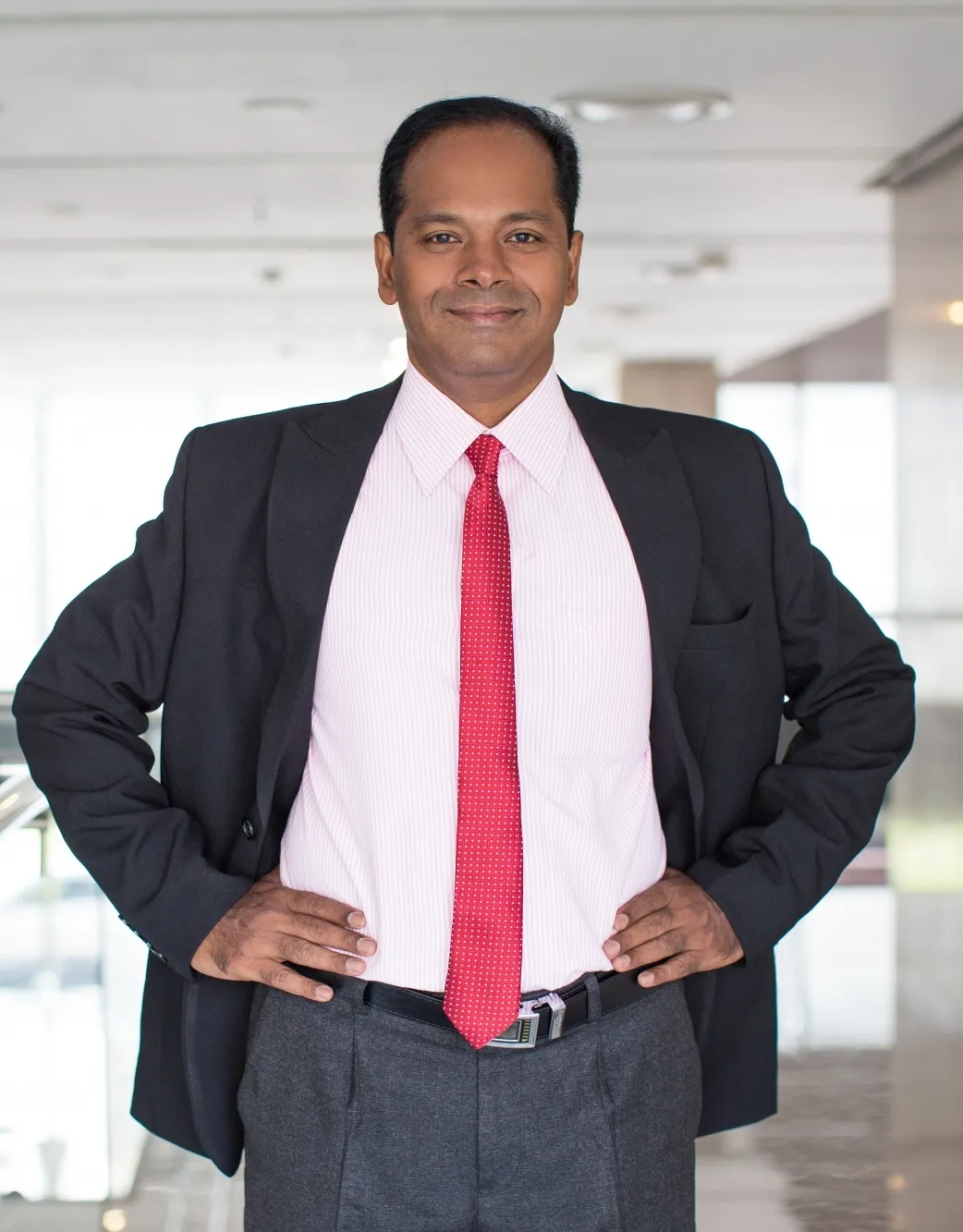 portrait-smiling-indian-businessman-office